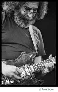 Jerry Garcia, playing guitar in concert with the Grateful Dead, Radio City Music Hall