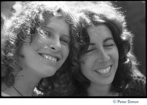 Usha (Cathy Brown) and Sara Davidson (right), close-up portrait leaning head to head, smiling