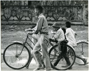 Man biking with children