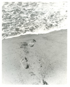 Footprints leading to ocean