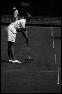 Croquet player striking a ball, Newport, R.I.