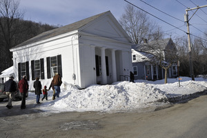 Aftermath of the Congregational Church fire in West Cummington, Mass.: exterior view of parishioners approaching the Parish House