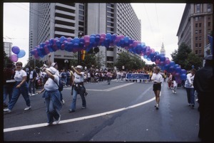 San Francisco AIDS Foundation marchers in the San Francisco Pride Parade, with next group carrying banner 'Fighting for our lives'