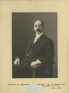 Frank A. Hosmer seated in a chair