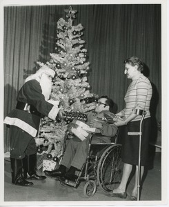 Santa Claus handing gifts to clients