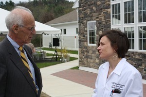 Congressman John W. Olver speaking with Lara Setti, Medical Director at CHP Health Center