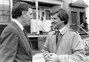 Mayor Raymond L. Flynn speaking in the street with Bobby Orr