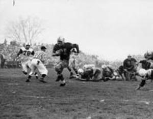 Williams #31 Chip Ide runs with football, 1958