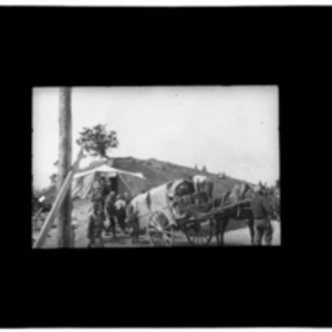 Horse-drawn wagons pull up to tent