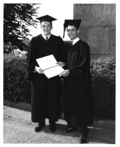 Students holding their degrees at the 1962 Suffolk University commencement