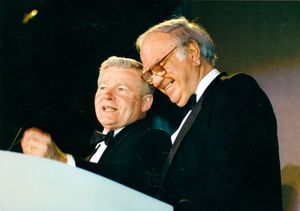 William M. Bulger (left) and John Joseph Moakley smiling at the podium at the Salute to Moakley event