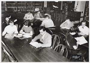 View of students studying in library at Boston Evening College