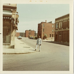Reverend Michael E. Haynes stands on the corner of an empty street in Lower Roxbury