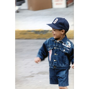 Portrait of a young Festival Betances attendee in a Thomas the Tank Engine jean jacket.