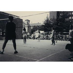 Women playing volleyball.