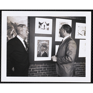 Dwight C. Shepler, at left, and Donald C. Murray view the Boys' Clubs of Boston Tri-Club Art Exhibit at the Museum of Science