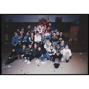 Teenagers pose for a group shot during a New Year's Eve party in the Charlestown Clubhouse