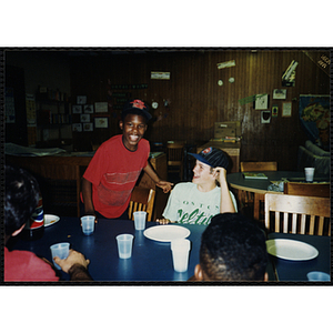 Two children gather at a table at the Tri-Club youth leadership event at the Roxbury Clubhouse