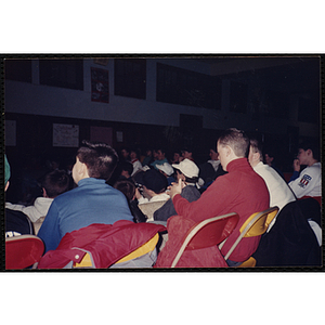 Teenagers watch the game at a Super Bowl XXII party