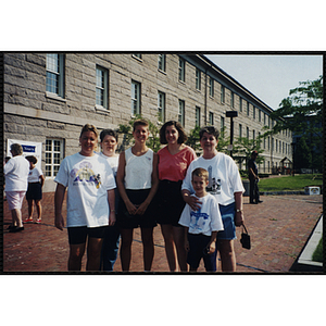 A group of women pose with a boy at the Battle of Bunker Hill Road Race