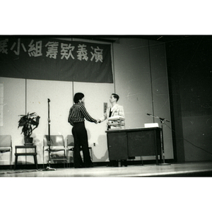 Two people shaking hands during a Chinatown Task Force Fundraiser