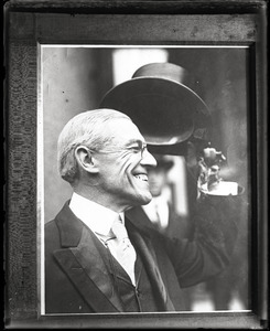 Woodrow Wilson, tipping his top hat