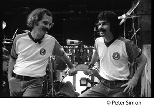 Bill Kreutzman (left) and Mickey Hart, drummers for the Grateful Dead, standing in front of their kit