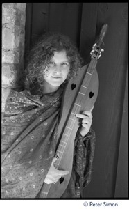 Usha (Cathy Brown): half-length portrait posed with a dulcimer