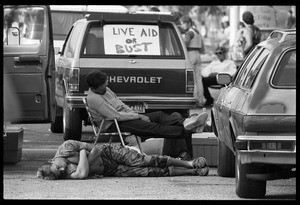 People crashed out in the parking lot at the Live Aid Concert