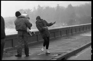 Judy Salonia, her husband Vincent, and daughter Ashley (4) dodge the spray at the Narragansett seawall