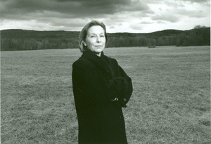 Valerie Martin standing by a field