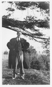 Frederick Troy standing under a tree limb