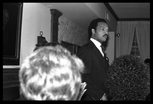 Jesse Jackson at the podium, addressing supporters