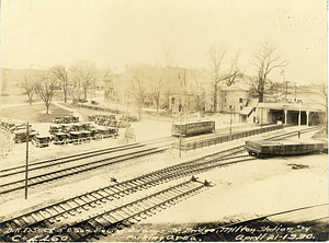 General view of Adams Street Bridge, Milton Station, and parking area