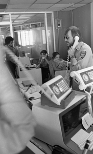 Unidentified call center workers in Boston Police Dispatch Operations Center