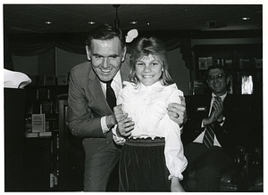 Mayor Raymond L. Flynn with an unidentified girl and man at the Boston University Bookstore