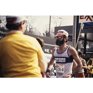 Runner in Boston hat and sunglasses Boston Athletic Association (BAA) marathon