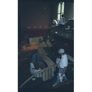 Volunteers build a counter out of plywood at the Jorge Hernandez Cultural Center.