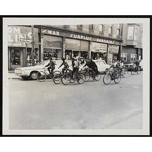 Boys ride bicycles in Dudley Square in Roxbury