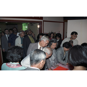 Guests waiting to get in to the Chinese Progressive Association's 20th Anniversary and the Workers' Center's 10th Anniversary Celebration