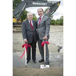 Dr. George J. Kostas and President Joseph E. Aoun pose together with shovels at the groundbreaking ceremony