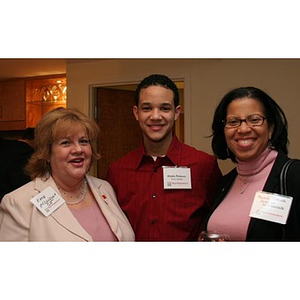 Odalis David Polanco poses with two women at a Torch Scholars event