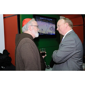 Cardinal O'Malley conversing with a guest at the Beanpot Reception