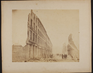 Firemen in the street outside a numbered building facade, 1872