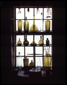 Antique bottles in window of Pine Kitchen, Beauport, Sleeper-McCann House, Gloucester, Mass.