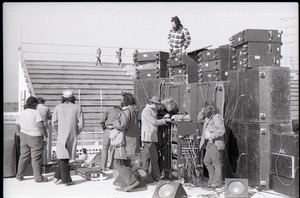 Hollywood Speedway Rock Festival: roadies setting up speakers and amps for concert