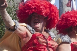 Float with The Hat Sisters, Tim O'Connor waving to the crowd : Provincetown Carnival parade