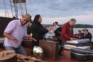 Guy Davis, Joanne Shenandoah, and David Amram (foreground from left) making music aboard the Mystic Whaler during the Clearwater Folk Festival