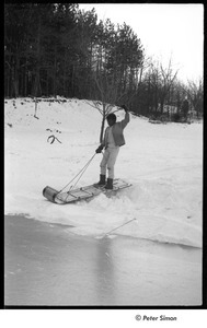 Party at Jackie Robinson's house: boy riding sled
