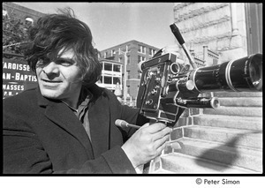 Jack Kerouac's funeral: Gregory Corso setting up film camera outside of church